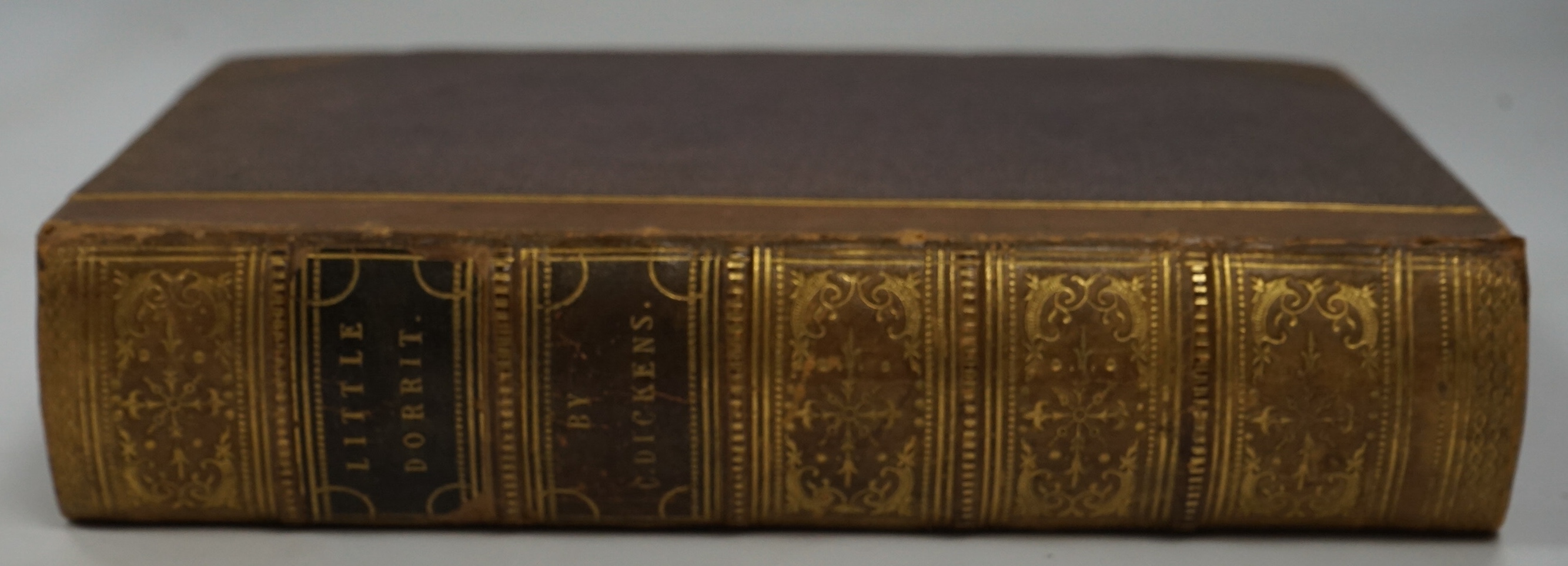 Dickens, Charles - Little Dorrit. First Edition. pictorial engraved and printed titles, frontis. and 38 plates (by H.K. Browne); near contemp. gilt ruled half calf and cloth, gilt extra decorated panelled spine with red